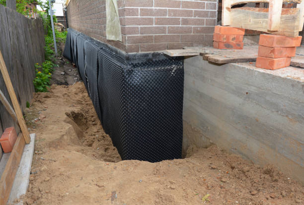 Happy homeowners after waterproofing job in Manahawkin